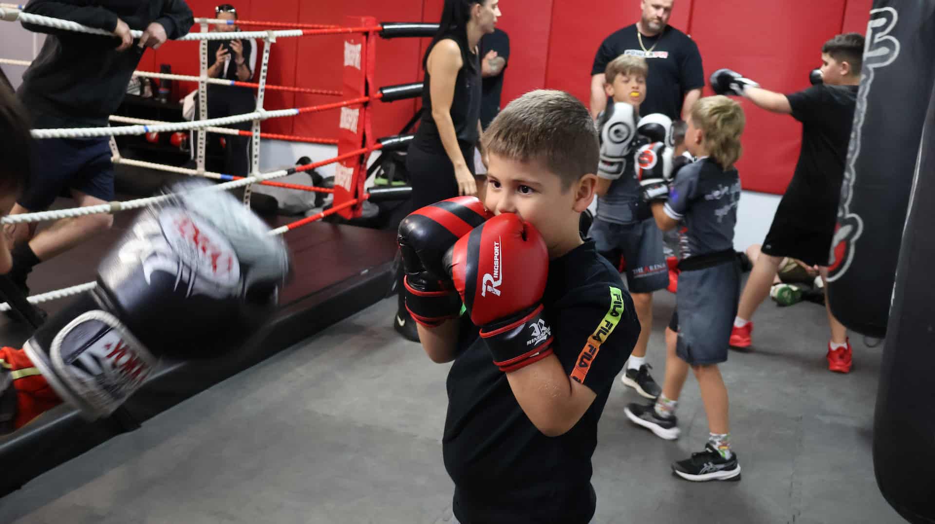 Kid doing boxing lessons
